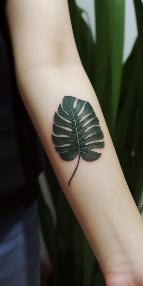 An enchanting small monstera leaf hand tattoo, featuring refined shading and lifelike lines in a striking design, exuding a sense of natural beauty. This delightful design showcases the elegance of nature, making it a perfect choice for those seeking a meaningful and artistic representation of their appreciation for the natural world on their hand. Monstera Leaf Tattoo, Hand Tatto, Leaf Tattoo, Latest Tattoos, Plant Tattoo, Face Tattoos, Tattoo Trends, Monstera Leaf, Geometric Art