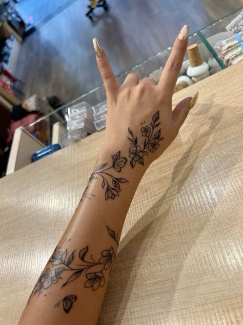 Tattoos With Deep Meaning For Black Women, Cute Outline Tattoos For Women, Hand Tattoos Wrap Around, Tiger Lily Vine Tattoo, Arm Sleeve With Small Tattoos, Personalized Tattoos Ideas, Leo Forearm Tattoo Women, Cardi B Tattoo Leg, Hibiscus Flower Back Tattoos