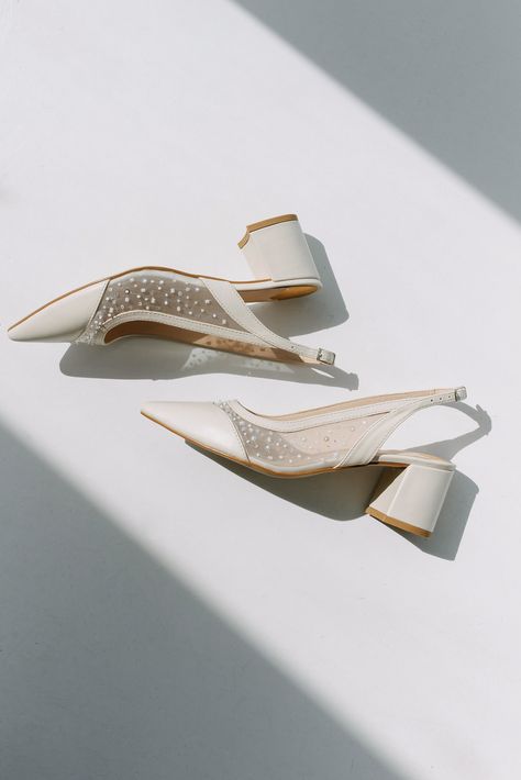 Wedding slingback pumps 'ICON' are handcrafted from soft white Italian leather. The pair of bridal heels features handmade sequin and bead embroidery on the soft mesh. This design also has pointy toes and a 5.5 cm / 2.2 inches stable block heel.  Inside there is a soft Memory foam insole, which gives a feeling of additional comfort when walking. Tunit outsole is made of a mixture of leather chips and rubber, it's more wear-resistant than leather and more durable. Also, we use soft natural upper Wedding Pumps, Beads Embroidery, Bridal Heels, Embroidered Wedding, Womens Wedding Shoes, Low Block Heels, Slingback Heel, Slingback Pump, Custom Shoes