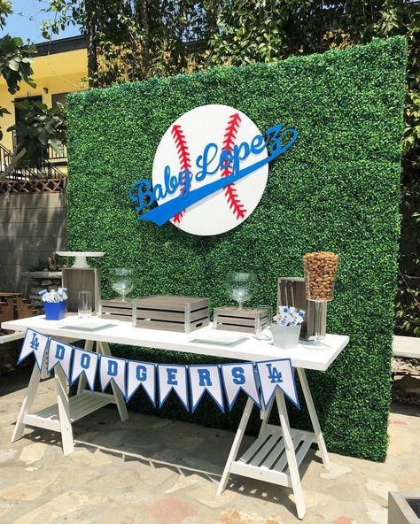 Dodger Baby Shower! Backdrop, base ball sign and table by @bizziebeecreations table decor provided by our client and display by @bizziebeecreations. Wood sign cut by @wolfelaserengraving and banner It’s to hot to put out the desserts and candy. #babyshower #backdrop #dodgers #dodgerbabyshower #catchmyparty #partytime #eventstylist #bizziebeecreations #partydecor #baseballbabyshower #baseballparty #decor #props #events #partyplanner #partyideas #partystyling #eventstylist #eventdecor #party #... Dodgers Baby Shower Ideas, Dodgers Birthday Party, Dodgers Party, Office Baby Showers, Baseball Theme Birthday, Baseball Baby Shower Theme, Sports Baby Shower, Baseball Theme Party, Baby Shower Dessert Table