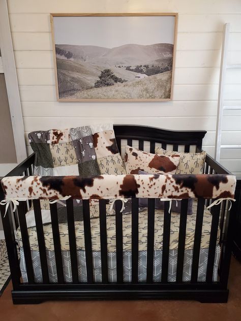 Perfect Ranch Western Crib Bedding for Nursery. Cow Minky, Cactus & Gray Arrow Complete the Theme of this Baby Bedding Set. Made In The USA. Customize It. Check out Our Additional Nursery Components Available on the Website or Contact Customer Service for Additional Help. 4pc set includes: skirt, sheet, 32x42 blanket, long rail guard. 3pc set includes: skirt, sheet, 32x42 blanket. **Please note: the gray steer fabric shown on the blanket is discontinued, and the gray steer swatch on the listing Western Crib Bedding, Western Baby Bedding, Western Crib, Neutral Crib, Crib Bedding Boy, Rail Guard, Farmhouse Nursery, Boys Crib, Stylish Nursery