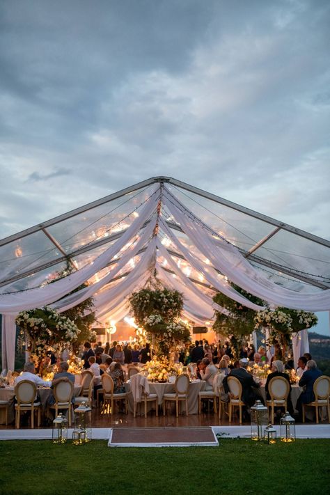 Clear wedding tent for reception decorated with white draping, fairy-lights and greenery | Charming wedding on the Cote d'Azur with the most jaw dropping florals | Cannes Real Weddings | Photography: CEDRIC KLEIN | Magnolia Rouge: Fine Art Wedding Blog Fairy Lights Tent Wedding, Clear Tent Wedding Reception Night, Clear Roof Tent Wedding, Boho Wedding Tent, Clear Tent Wedding Reception, Tent Wedding Decorations, Clear Top Tent Wedding, Clear Wedding Tent, Wedding Cabana