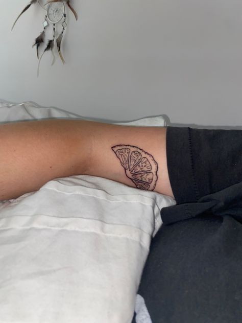 Orange slice tattoo. Lemon wedge tattoo Like Wedge Tattoo, Sliced Fruit Tattoo, Orange Outline Tattoo, Oranges Tattoo Fruit, Orange Slice Tattoo Traditional, Lemon Slice Tattoo Minimalist, Orange Slice Tattoo Black And White, Orange Wedge Tattoo, Simple Orange Tattoo