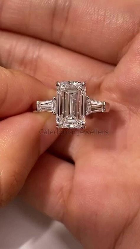 Emerald Cut Three Stone Ring, 4.0 CT Emerald Cut Colorless Moissanite Engagement Ring, Tapered Baguette Side Stone Anniversary Gift for Her. 💎𝐑𝐢𝐧𝐠 𝐂𝐞𝐧𝐭𝐞𝐫 𝐒𝐭𝐨𝐧𝐞: ✤ 𝐒𝐭𝐨𝐧𝐞 𝐓𝐲𝐩𝐞: Moissanite  ✤ 𝐒𝐭𝐨𝐧𝐞 𝐒𝐡𝐚𝐩𝐞: Emerald Cut (4 CT) ✤ 𝐒𝐭𝐨𝐧𝐞 𝐒𝐢𝐳𝐞 𝐀𝐯𝐚𝐢𝐥𝐚𝐛𝐥𝐞: 0.20CT(2*4mm), 0.50CT(3*5mm), 0.80CT(4*6mm), 1CT(5*7mm), 2CT(6*8mm), 3CT(7*9mm), 4CT(8*10mm), 5CT(9*11mm), 8CT(10*12mm), 10CT(10*14mm), 12CT(12*14mm) ✤ 𝐂𝐨𝐥𝐨𝐫: D color ✤ 𝐂𝐥𝐚𝐫𝐢𝐭𝐲: VVS1 clarity Emerald With Baguettes Engagement, Emerald Engagement Ring 3 Stone, Emerald Cut 3 Stone Ring, Classic Winston Emerald-cut Engagement Ring With Tapered Baguette Side Stones, Baguette Side Stone Engagement Ring, Emerald Cut With Tapered Baguettes, Emerald Baguette Engagement Ring, Emerald Cut Engagement Ring Thick Band, 4 Carat Emerald Engagement Ring