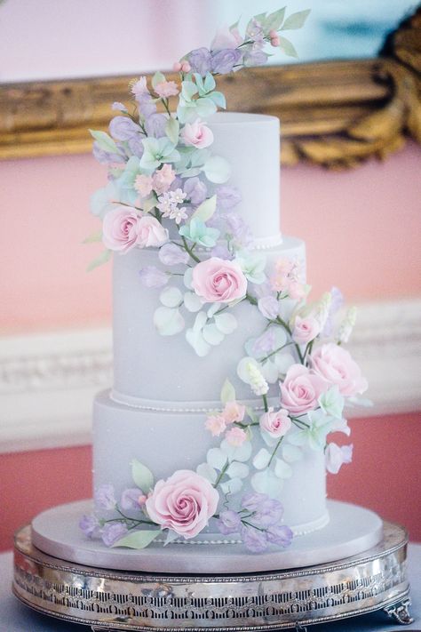 Sweet Pea Wedding Cake, Wedding Cake With Pastel Flowers, Pastel Colours Wedding Theme, Pastel Blue And Lilac Wedding, Wedding Cakes Pink And Blue, Purple Pink Blue Wedding Theme, Pastel Color Wedding Cake, Lilac And Blue Wedding Cake, Pastel Wedding Cake Ideas