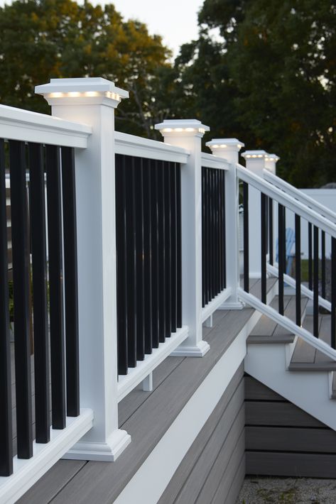 Our composite railing collection offers the most customization and style options to complement your decking. Not only that, it brings resilience to stand strong against more challenging climates with durability that goes well beyond the surface. Check out more of the features of our lineup. Railing: Classic Composite Series - Premier Rail - White Gray And White Deck, Diy Front Porch Railing Ideas, Outside Railing Ideas, Deck Stairs To Patio, Under Deck Skirting Ideas, Composite Decking Steps, Diy Deck Decor, Composite Deck Ideas, Trex Deck Colors