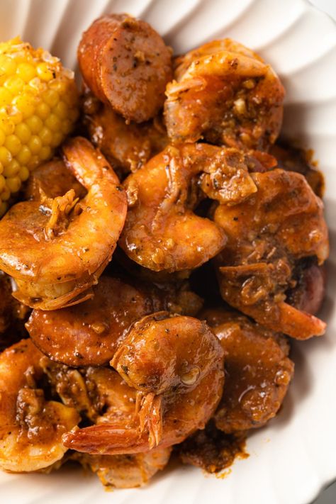 This boiling grab sauce is the best sauce for a Cajun shrimp boil. It contains a mix of butter, garlic, and plenty of spices that act like a flavor bomb. It's so flavorful, you'll use this recipe time and time again. Cajun Shrimp Broil Recipes, Louisiana Boiled Shrimp, Louisiana Shrimp Boil Recipe, Crab Boil Recipe Cajun Sauce, Shrimp Boil Recipe Stovetop, Shrimp Boil Sauce Recipe, Spicy Shrimp Boil Recipe, Cajun Seafood Boil Louisiana, Chicken Boil Cajun