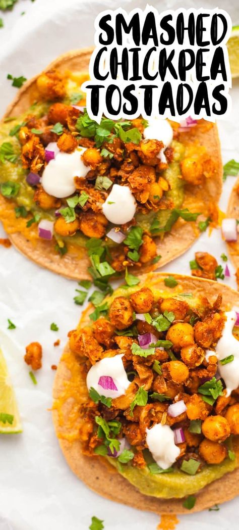 These EASY vegetarian tostadas have smashed crispy fried chickpeas for their topping - so flavorful with the perfect blend of spices! A cheesy base, guacamole and some tangy onion and cilantro round it off to the perfect combination of flavors and textures to make these meatless tostadas shine. Crispy Chickpea Tacos, Vegetarian Tostada Recipes, Meatless Tostadas, Tostada Vegetarian, Chickpea Tostadas, Tostadas Vegetarian, Vegetarian Tostadas, Fried Chickpeas, Meatless Meals Healthy