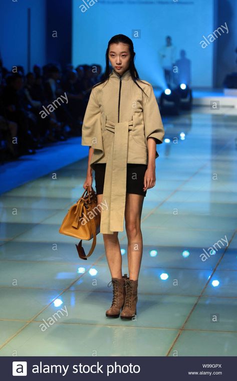 A model poses at Camilla Wellton fashion show during the Shanghai 2012 Spring/Summer Fashion Week in Shanghai, China, 27 October 2011. Stock Photo Summer Fashion Week, Law Practice, Shanghai China, Model Poses, Shanghai, Spring Summer Fashion, Fashion Show, Summer Fashion, Fashion Week