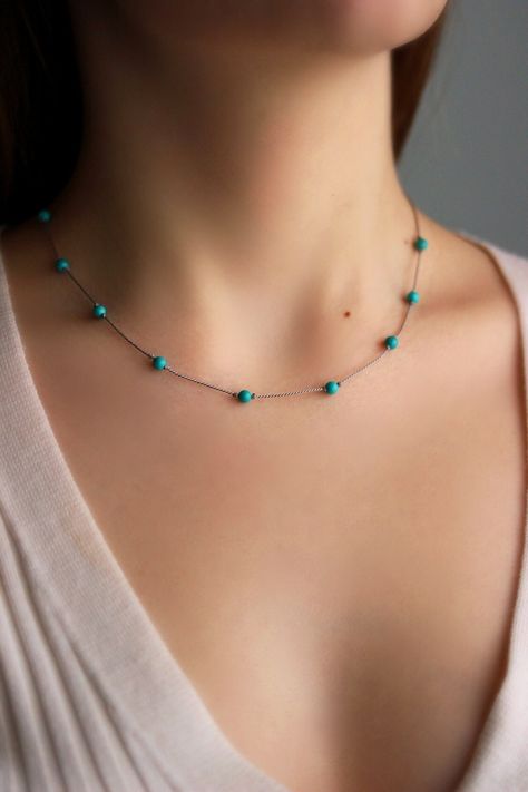 This lightweight minimalisе dainty necklace was made of natural turquoise stone 4 mm beads, natural silk cord with stainless steel clasps on the ends and stainless steeò lobster clasw. Perfect for everyday wear or an a great gift! The length of chain is about 44.5 cm or about 17.5 inches and 4 cm of adjustable length stainless steel chain. Other necklaces of my shop you can see here: https://www.etsy.com/shop/NaTavelli?section_id=14843046&ref=shopsection_leftnav_5 Thanks for a visit. Turquoise Beads Necklace, Turquoise Necklace Outfit, Diy Earrings Box, Stone Beads Necklace, Silk Thread Necklace, Silk Cord Necklace, Short Necklaces, Stackable Necklaces, Silk Necklace