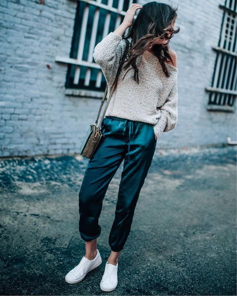 silk jogger pant style, fall outfit, slide on sneakers, off the shoulder sweater style @prettyinthepines Velvet Joggers Outfit, Satin Joggers Outfit, Jogger Outfit Casual, Satin Pants Outfit, Silk Joggers, Estilo Tomboy, Slide On Sneakers, Jogger Pants Outfit, Velvet Joggers