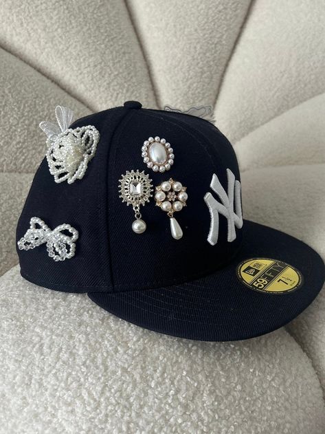 Each charm is hand placed by me. Decorated Baseball Caps, Merch Ideas Products, Custom Hat Ideas, Bedazzled Hat, Nyc Hat, Bling Hats, Yankee Fitted, Custom Fitted Hats, Ny Hat