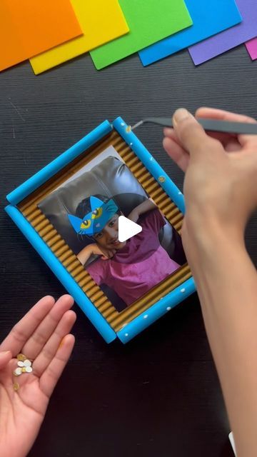 CraftISH corner on Instagram: "DIY Picture Frame Idea for Kids! 🖼️ 

Looking for a cool summer project before school starts? This DIY picture frame is perfect! It’s a great way to create memories and could be a fantastic desktop decor for anyone in the family.✨

Follow for more @craftishcorner 

Youtube link in bio ⬆️ 
.
.
.
.
.
#diyframe #diypictureframe #diyphotoframe #cardboard #cardboardframe #cardboardcrafts #papercrafts #paperdecor #homedecorideas #deskdecor #tabledecor #tabledecorideas #tabletopframe #wallframediy #walldecorideas #photodiy #pictureframeidea #desktopdecor #deskdecordiy #deskdecor #deskdecorideas" Easy Diy Photo Frames, Frame Crafts For Kids, Diy Frame Ideas, Wall Frames Diy, Kids Art Space, Photo Frame Crafts, Diy Picture Frame, Family Frame, Before School Starts