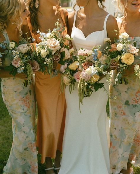 I hope colorful wedding days are here to stay 😌 especially the whimsy florals & mix and match bridesmaid dresses 🧡 #iowaweddingphotographer #desmoinesweddingphotographer #desmoineswedding #weddingcolorscheme #colorfulwedding #iowaphotographer Peach And Sage Bridesmaid Dresses, Floral Mix Match Bridesmaid Dresses, Mix Match Floral Bridesmaid Dresses, Spring Floral Bridesmaid Dresses, Mix Match Bridesmaid Dresses Spring, Mix Match Bridesmaid Dresses Fall, Fall Floral Bridesmaid Dresses, Mixed Floral Bridesmaid Dresses, Boho Bridesmaid Dress Mismatched