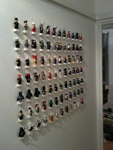 The perfect way to display your lego minifigs collection! Instead of wall put in picture frame glue blocks to glass and have labels for each one in the frame for character and group or batman, Star Wars, ect... Deco Lego, Lego Wall, Lego Display, Lego Room, Lego Storage, Lego Figures, Boys Bedrooms, Display Storage, Cool Ideas