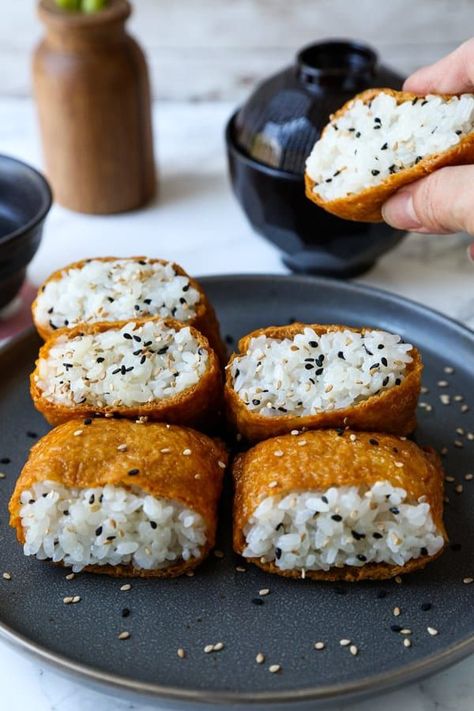 This delicious Inari Sushi recipe is both sweet and savory and can be served as a snack or as a side dish. Grab the recipe here! Inari Sushi, Sushi Rice Recipes, Sushi Dinner, Cibo Asiatico, Sushi Recipes, Japanese Cooking, Japanese Dishes, Sushi Rice, Sweet And Savory