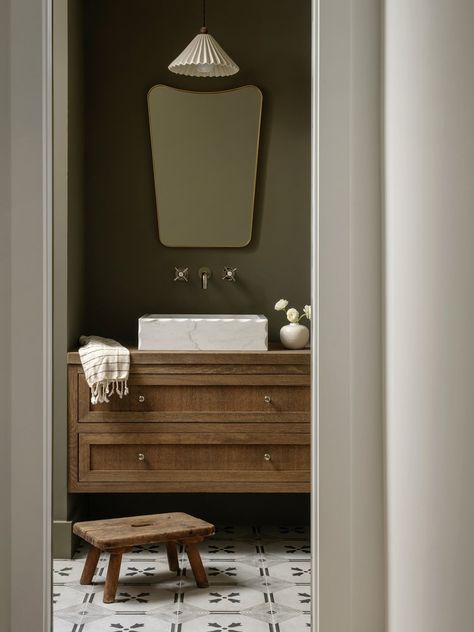 Dark and moody powder room by Cedar and Oak Homes, Austin Design Build Firm Dark Green Powder Bath, Moody Modern Powder Room, Dark Painted Powder Room, Minimalist Powder Room Ideas, Small Moody Powder Room, Color Drenched Powder Room, Moody Dark Bathroom, Studio Mcgee Powder Room, Moody Bathroom Colors