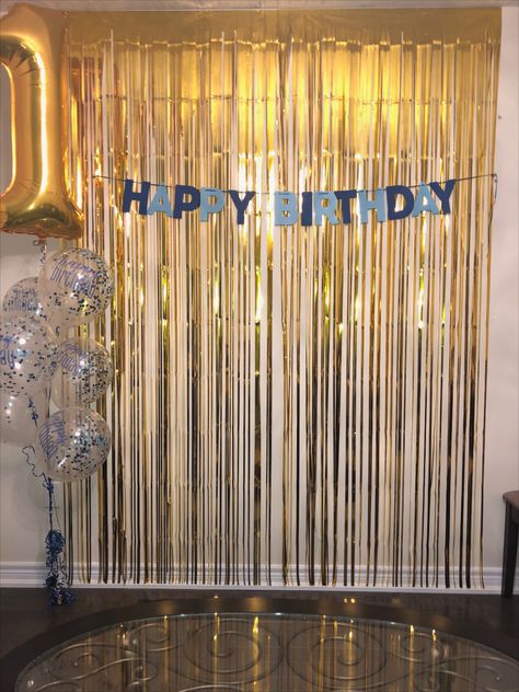 A simple birthday backdrop, using gold fringe and blue accents. Featuring, confetti balloons and a gold foil 1.  . . . . #happybirthday #birthdayparty #birthdaybackdrop #goldfringe #goldandblue Foil Fringe Backdrop Ideas, Simple Birthday Backdrop, Gold Theme Birthday, Apartment Party, Sparkle Birthday, Streamer Backdrop, Blue Birthday Parties, 21st Birthday Decorations, Party Streamers