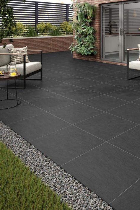 Sleek and sophisticated, the rich black colour of Baslow will add a contemporary edge to any outdoor setting. Crafted from high-quality porcelain, Baslow Black is built to withstand the elements, ensuring long-lasting performance and minimal maintenance. From patios to pathways, Baslow Black creates a bold and striking statement that stands the test of time. Choose from 60x90 or 60x60 sizes, or even combine them for an individual and unique look. Dark Paving Patio, Tiles For Garden Floors, Exterior Tiles Floors, Terrace Flooring Ideas Outdoor, Car Porch Floor Tiles Design, Outdoor Porcelain Tile Patio, Porch Tiles Outdoor, Garden Tiles Outdoor, Parking Tiles Design