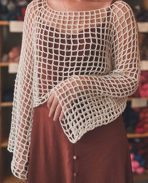 Check out this super cute top crocheted by our own Katie S.! This pattern is Island Mesh Top by @knittybae and is available on her website - https://www.knittybae.com/product/island-mesh-top-pattern/. It is rated at advanced beginner. Katie used Anne, a fingering weight 100% cotton yarn from @circulo.usa to create it. What a great layering piece! Great work, Katie! Thanks for tagging us in your post! * * * #KnitAndStitchBoutique #FloridaYarnShop #FloridaYarnStore #LocalYarnStore #Local... Crochet Long Sleeve Top For Layering, Mesh Top Crochet, Crochet Mesh Top, Mesh Flower Crochet Top, Crotchet Mesh Sweater, Diamond Mesh Stitch Crochet Top, Oversized Mesh Crochet Top, Local Yarn Shop, Yarn Store