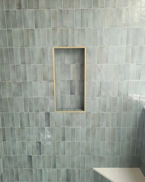 Shower With Metal Trim, Brass Tile Trim Bathroom, Shower Niche With Schluter Trim, Gold Schluter Tile Edge, Schluter Tile Edge Showers, Herringbone Niche, Kylie Bathroom, Schluter Niche, Shower Niche Trim