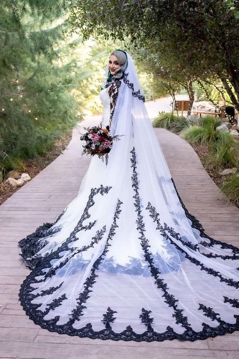 Our Raisa custom black and white mermaid wedding dress has been created for our bride, Raisa . It features gorgeous black lace with ivory satin/tulle , and it has a gorgeous illusion back with black buttons . The perfect choice for a halloween wedding!  If you need another custom gown to be made for you, kindly contact Brides & Tailor first. You can see videos of this gown on our instagram page: https://www.instagram.com/p/CeyIc6WP8jX/ Creepy Wedding Dress, Black And White Wedding Dress With Sleeves, White Wedding Dress With Black Lace, Wedding Dress With Black Accents, White Gothic Wedding Dress, Vampire Wedding Dress, White And Black Wedding Dress, Wedding Dress Medieval, Black And White Mermaid