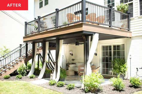 Exterior view of newly renovated patio with outdoor curtains. Backyard Under Deck Patio Ideas, High Decks Backyard, Deck With Patio Underneath, 2nd Floor Deck Ideas, Sunroom Backyard, Second Floor Deck Ideas, Under Deck Ideas, Under Deck Patio Ideas, Townhouse Patio