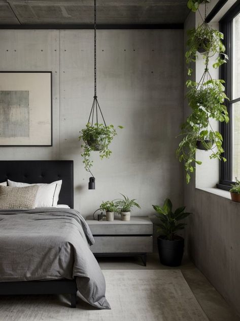 Elevate your urban design bedroom with a statement concrete accent wall and sleek black furniture. Add a touch of greenery with hanging plants and incorporate industrial lighting for a modern and edgy look. Concrete Apartment Aesthetic, Industrial Tropical Bedroom, Gray Bedroom With Plants, Industrial Black Bedroom, Soft Industrial Decor Bedroom, Bedroom Ideas For Men Plants, Edgy Decor Interior Design, Industrial Theme Bedroom, Black Bedroom With Plants