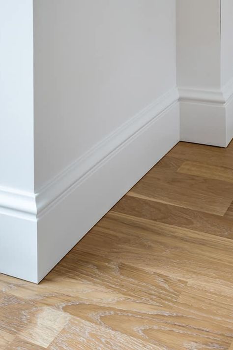 Baseboards are the unsung heroes of home design, offering both protection and a polished look to the walls they adorn. Selecting the right size is essential for the overall harmony of your room's design. Standard baseboard sizes can vary, and choosing the appropriate one can enhance the stature and flow of your space. This guide aims to demystify the standard dimensions of baseboards to help you make the best choice for your home. Room Baseboard Ideas, 1x6 Trim Baseboards, French Country Baseboards And Trim, Floor Trim Ideas Baseboards Modern, Elegant Baseboards And Trim, Cottage Style Baseboards And Trim, Studio Mcgee Baseboards, Large Baseboard Trim, Baseboard Trim Styles Farmhouse