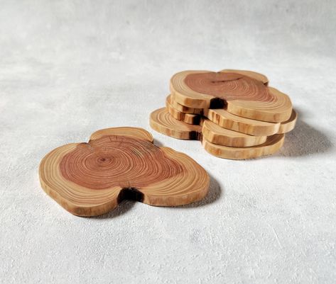 This is a set of high quality six juniper wood slices (coasters). This beautiful juniper wood coaster protected with oil Rubio Monocoat pure. Unique branch form. What you see is what you get. Sanded to very smooth finish and cracks are filled. Do not wash them in the dishwasher. Gently wipe them with a wet dish washing sponge (softer side) and wipe with a dry cloth. Dimensions: 9-10 x 1 cm (3,5"- 4" x 0,39"). https://www.etsy.com/shop/HeroesCreations Juniper Wood, Farmhouse Table Decor, Rubio Monocoat, Dish Washing, Wooden Slices, Wood Pallet Projects, Wooden Coasters, Raw Wood, Wood Slices