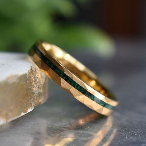 Discover the perfect blend of sophistication and strength with our 4mm Gold Hammered Tungsten Ring featuring a captivating Malachite Inlay. The hammered gold detailing adds a distinctive touch, while the malachite inlay not only introduces a burst of color but also brings with it the potential benefits of promoting balance and transformation. Embrace a durable symbol of your commitment, enriched with the unique properties of malachite – a stone believed to encourage positive energy and personal Men's Wedding Ring Gold, Mens Wedding Rings Gold Unique, Gold Rings For Men Unique, Men’s Rings, Men’s Wedding Rings, Gold Wedding Rings For Men, Male Wedding Rings, Man Wedding Ring, Unique Mens Wedding Bands