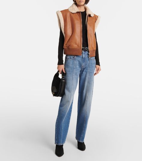 Edwina shearling-trimmed leather vest in brown - Isabel Marant | Mytheresa Shearling Vest, Isabel Marant Etoile, Leather Vest, Jersey Top, Suede Ankle Boots, Leather Care, Isabel Marant, Wide Leg Jeans, Autumn Winter Fashion