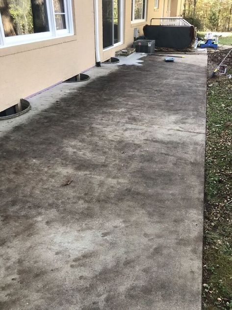 I transformed our ugly old concrete patio with some cleaning and an easy-to-apply tinted sealer!Here's how to do it yourself... When we moved into our new house the back concrete patio was in rough shape.It had been stained over the years from leaf debris and dirt ground into concrete that I suspect was never sealed. I started out by using this Purple Power Driveway & Concrete Cleaner.I diluted it according to the instructions and applied it with a stiff brush. Well after I used… Resurfaced Concrete Patio, Old Sidewalk Makeover, Cement Staining Outdoor, How To Seal Concrete Patio, Staining Concrete Driveway, Black Stained Concrete Patio, Sealing Concrete Patio, How To Clean Concrete Patio, Old Concrete Patio Makeover