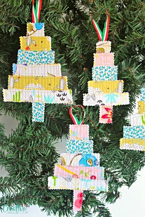 "Looking to add a fresh and creative touch to your holiday décor? Look no further! In this easy peasy tutorial I’ll show you a simple and fun way to ditch the traditional ornaments and create stunning quilted Christmas tree ornaments with ease using nothing but scraps from old quilting projects, thread, a piece of ribbon and your sewing machine. So let’s spice up your holiday décor by crafting stunning quilted Christmas ornaments from quilted fabric scraps. " Quilted Christmas Tree, Sewn Christmas Ornaments, Traditional Ornaments, Quilted Ornaments, Quilted Christmas Ornaments, Quilted Gifts, Christmas Tree Crafts, Felt Christmas Tree, Mini Ornaments