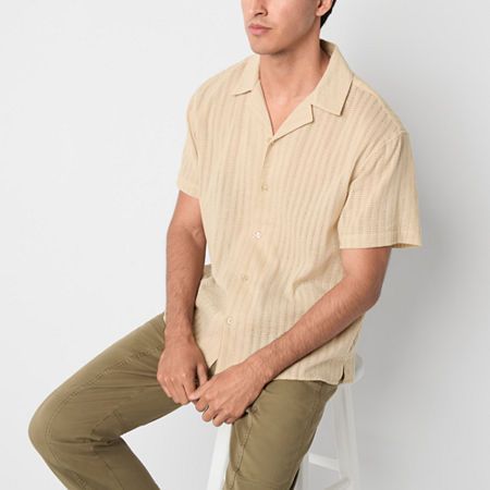 This Arizona Jean Co. men's short-sleeve textured button-down shirt in khaki effortlessly combines comfort and style. It's crafted from 100% cotton and features a slim-fit and a collar neck. Wear yours on its own or layered over a muscle tank for a laid-back look. Closure Type: ButtonFit: Slim FitNeckline: Collar NeckSleeve Length: Short SleeveApparel Length: 29 InchesFiber Content: 100% CottonFabric Description: WovenCare: Tumble Dry, Machine WashCountry of Origin: Imported Beige Top Outfit, Short Sleeve Shirt Outfit, Shirt Outfit Men, Basic Wardrobe, Button Up Shirt Mens, Collar Neck, Beige Top, Mens Button Up, Large Shirts