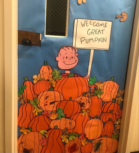 I had my kids in my class color their own pumpkins and some leaves and i drew the Character and taped it on my blue butcher paper Great Pumpkin Charlie Brown Door Decor, Pumpkin Patch Door Decoration, Pumpkin Classroom Door Ideas, Dorm Door Decorations Halloween, Pumpkin Door Decorations Classroom, Pumpkin Patch Classroom, Pumpkin Classroom Door, Charlie Brown Great Pumpkin, Library Hallway