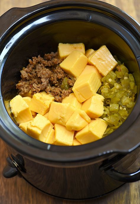 Beef Cheese Dip made easy in the slow cooker! Loaded with taco meat, cheese, and diced green chilies, it's seriously addicting! Cheese Steak Dip Crock Pot, Green Chili Cheese Dip, Crockpot Snacks, Chili Cheese Dips, Crock Pot Dips, Simple Pantry, Diced Green Chilies, Pantry Ingredients, Fresh Tomato Salsa