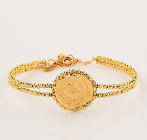 ♡ Bart's Fine Jewelry ♡ Handmade Turkish 22K 916 Solid gold ottoman signature lira coin bracelet. Bracelet interior dimensions : adjustable ( 58mm - 64mm ) Features: ▶ Made to order ▶ %100 Handmade ▶ Material: Solid gold (not filled or plated) ▶ Gold kt: 22K (916) ▶ Craft time: 3-10 days (depends on atelier workload) ▶ Shipping time: 1-3 days 📦 Packaging 📦 As Bart's, we make the packaging very safe in 2 stages with minimum use of plastic. 🎁 First, we place the products in the Bart product box Turkish Gold Jewelry, Gold Ottoman, Faberge Jewelry, Product Box, Coin Bracelet, Adjustable Bangle, Gold Coin, Craft Time, Jewelry Inspo