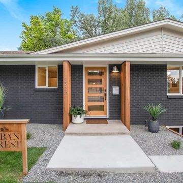 Exterior Paint Modern House, Midcentury Modern Exterior Door, Dark Gray Mid Century Modern Exterior, White Midcentury Modern House Exterior, Small House Paint Exterior Modern, Mcm Ranch Exterior, Painted Brick Mid Century Modern, Mid Mod Exterior Makeover, Coastal Mid Century Modern Exterior