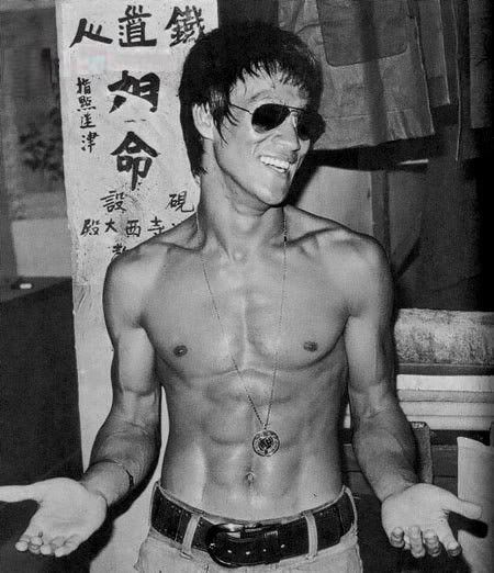 Bruce lee, get your Aviators at http://www.sunglassesuk.com/rayban-rb-3025-sunglasses.html from £75.00 Bruce Lee Photos, Jeet Kune Do, Brandon Lee, Ju Jitsu, Martial Artist, Wing Chun, Red Bubble, Terminator, Bruce Lee