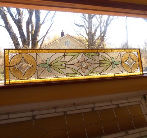 County style Farm House Stained Glass Transom. An intricate design using pastel English Muffle Glass and a few bevels. Measures 46x10. Add a classic to brighten up your front door entrance, add privacy or just a touch of pretty. This is a beautiful Victorian style transom. Price is based on size and design, contact me for a custom quote.  Add hooks for an amazing suncatcher, request size and hooks! Shipping charges may change depending on your location.  Final piece solder lines are in silver, but can be changed to copper or black - $20 add'l charge.  Easy install, here is informational video. http://www.youtube.com/watch?v=kpzsl5DtSmc For decoration only, contains lead. I do custom orders. Convo me at GlassbrookDesigns or email me at sandraglassbrook  yahoo.com If you read this far and fe Stained Glass Privacy Window, Transom Window Stained Glass Ideas, Stained Glass Doorway, Stained Glass Above Doorway, Horizontal Stained Glass Panels, Stained Glass Transom Window Above Door, Victorian Stained Glass Panels, Craftsman Interior Design, Stained Glass Transom Window