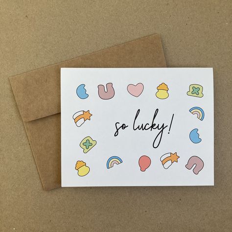 This single-folded greeting card has colorful shapes scattered around text that reads, "So Lucky!" The inside of the card is blank.  Each card purchased comes with one brown kraft envelope.  Card dimensions: 4.25" wide by 5.5" tall Envelope dimensions: 5.75" wide by 4.375" tall Free shipping is available however tracking is included is not scanned accurately at the time of delivery. If you would like to be able to accurately track your order, please select an upgraded shipping option at check-ou Random Cards For Friends, Cute Card Sayings, Pun Greeting Cards, Cute Simple Card Ideas, Good Luck Card Ideas, Handmade Thank You Card, Punny Valentines Day Cards, Good Luck Cards Handmade, Cute Cards Diy