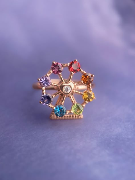 Ferris Wheel Ring lovingly designed by Love Estella Jewelry. All original designs - conceptualized, drawn and crafted by our team. Happy sparkly colours to make your day! Set in Garnet, Citrine, Peridot, London Blue Topaz, Iolite, Tanzanite & Tourmaline. Material: Sterling 925 Silver plated 18k Gold. Size: Adjustable Band fits US5-US10 (Fits super comfortably like a fixed ring size). Three hardware available - Rose Gold, Silver & Yellow Gold. Rainbow Ring, Rainbow Rings, Natural Gemstone Ring, Natural Gemstone Jewelry, Funky Jewelry, Jewelry Lookbook, Girly Jewelry, Jewelry Inspo, London Blue Topaz