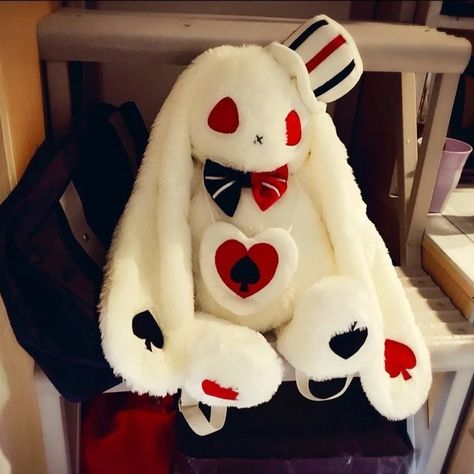 This creepy cute white rabbit plush backpack is a must have for any kawaii babe with a love for dark gothic fashion, with a kawaii twist!  Featuring a sweet long-eared bunny with red eyes, a stitched up mouth, and black and white bow tie as well as poker playing card embroidery all over! Cheeky, cute, and slightly evil Creepy Stuffed Animals, Doll Backpack, White Bow Tie, Kawaii Bunny, Plush Bags, Plush Backpack, Kawaii Plush, Kawaii Plushies, Cute Stuffed Animals