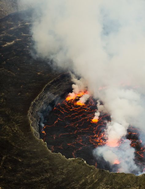 7tripsOn.com | Mount Nyiragongo (3470 m), Democratic Republic of the Congo in Pictures Mount Nyiragongo, Democratic Republic Of The Congo, Lava Flow, Natural Phenomena, Belleza Natural, Aerial View, Natural Disasters, Amazing Nature, Volcano