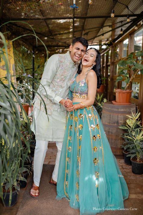 Haldi portrait, bride and groom, Mirrorwork lehenga, sea green lehenga, bridal lehenga, groom outfit for haldi, marigold decor, brass elements, mirrorwork drapes, traditional dancers, dhol beats, playful haldi, wedding decor, wedding planning, wedding inspiration, Indian wedding, vibrant celebration, wedding photography, joyful ceremony, wedding traditions, wedding photos Green Haldi Outfit For Bride, Haldi Decoration Indoor, Haldi Ceremony Outfit For Bride And Groom, Sea Green Lehenga Bridal, Haldi Outfits For Bride And Groom, Haldi Ceremony Outfit For Bride Indian, Haldi Portrait, Haldi Dress For Bride Indian, Lehenga For Haldi Ceremony