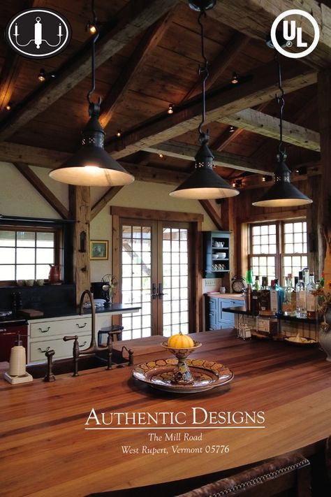 Three Beattie Barn pendants hang from surveyor hooks and act as beautiful island lighting for this spacious timber framed kitchen. Rustic Hanging Lights Kitchen, Cabin Lights Fixtures, Cabin Light Fixtures, Rustic Island Lighting, Pub Lighting, Barn Beam Lighting, Log Cabin Lighting, Timber Frame Kitchen, Log Home Kitchen