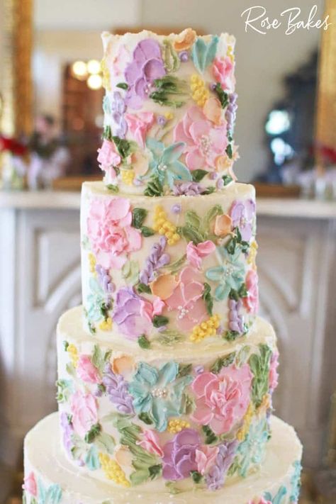 This Bridgerton-Inspired Wedding Cake is one of my all-time favorite wedding cakes. With buttercream flowers in soft pastels and tiny pearls for a touch of timeless elegance, this wedding cake is the perfect picture of the whimsy and color of a fairy tale. Cakes With Buttercream Flowers, Rainbow Wedding Cake, Wedding Cake Videos, Garden Wedding Cake, Bridgerton Inspired, Floral Wedding Cake, Rainbow Wedding, Buttercream Flowers, Painted Cakes