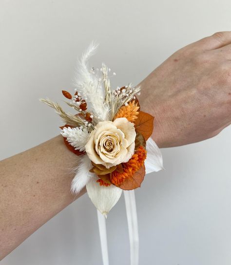 Lunaria Flowers Wedding | Add a touch of elegance to your special day with our exquisite wedding wrist corsages! Perfect for bridesmaids, mothers of the bride, or… | Instagram Burnt Orange Wedding Boutonniere, Burnt Orange Corsage, Corsage Wedding Mother, Burnt Orange Bridal Bouquet, Rusting Wedding, Western Themed Wedding, Wrist Corsages, Burnt Orange Weddings, Wedding Dresses With Straps