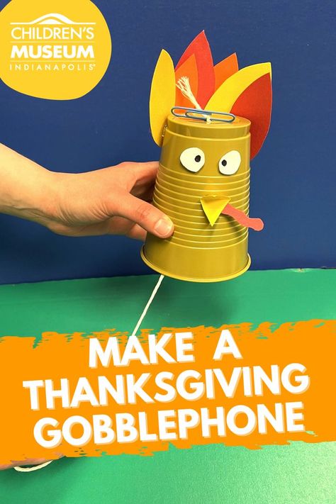 A gold plastic cup is turned upside down and decorated with eyes, a beak, and feather made out of paper. There's a string coming out of the bottom of the cup with a hand pulling it tight. Thanksgiving Science For Preschool, November Science Activities For Kindergarten, Steam Thanksgiving Activities, November Enrichment Activities, Turkey Windsock Craft, Thanksgiving Craft Older Kids, Stem Turkey Activities, Preschool Turkey Science Activity, Thanksgiving Themed Stem Activities